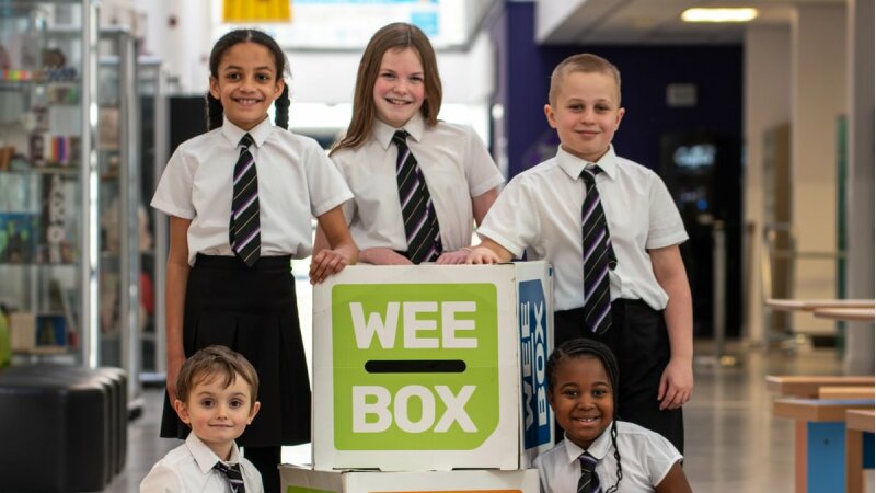 St John's Academy Perth students with a large box with 'WEE BOX' on it